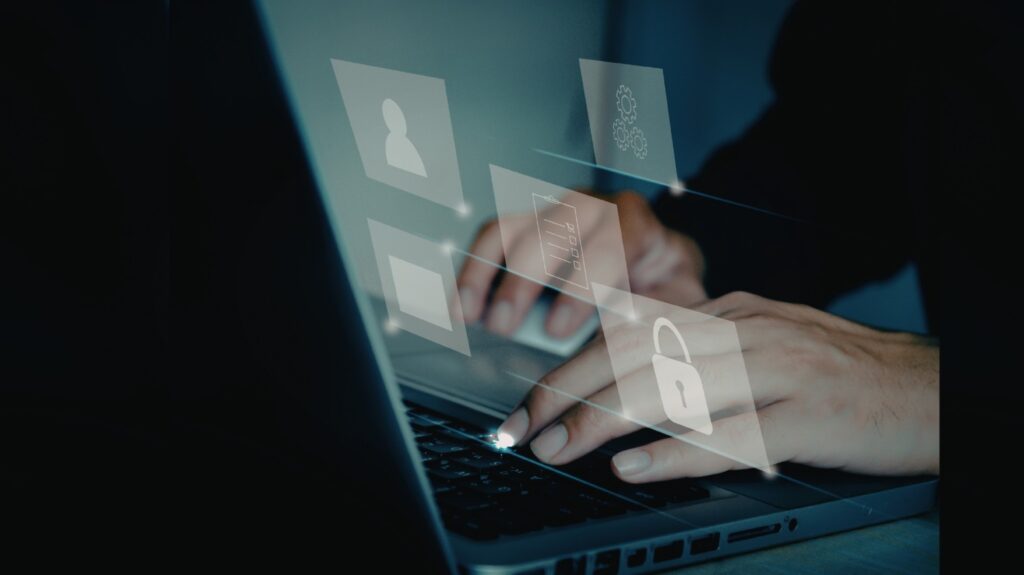 Close-up of hands typing on a laptop with digital cybersecurity icons overlayed, alongside the text ‘Why Businesses in Singapore are Prioritising Penetration Testing in 2026